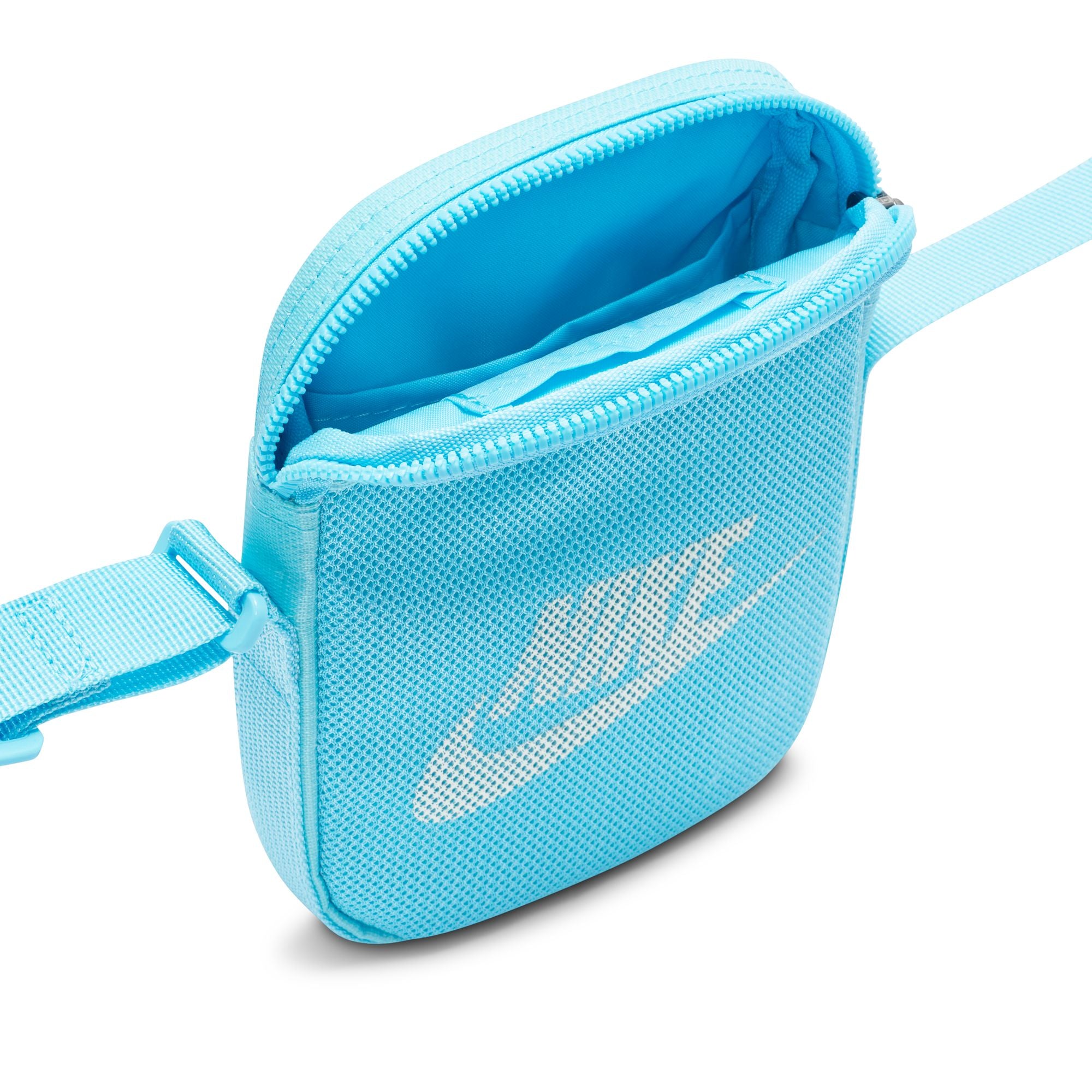 Light blue nike crossbody bag with mesh front pocket and white nike swoosh logo. Free uk shipping over £50