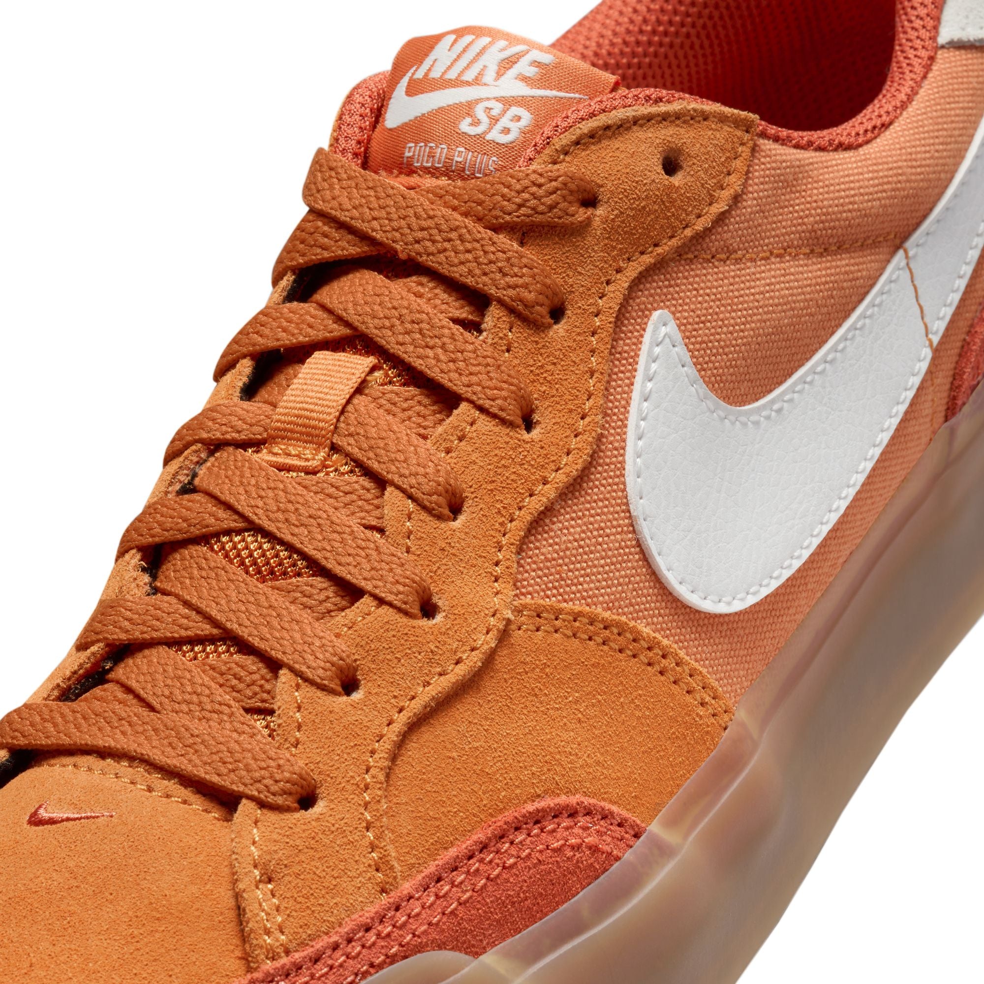 Low top Nike SB Pogo Plus skate shoe in monarch orange colour, with a gum sole and white nike swoosh on sides.