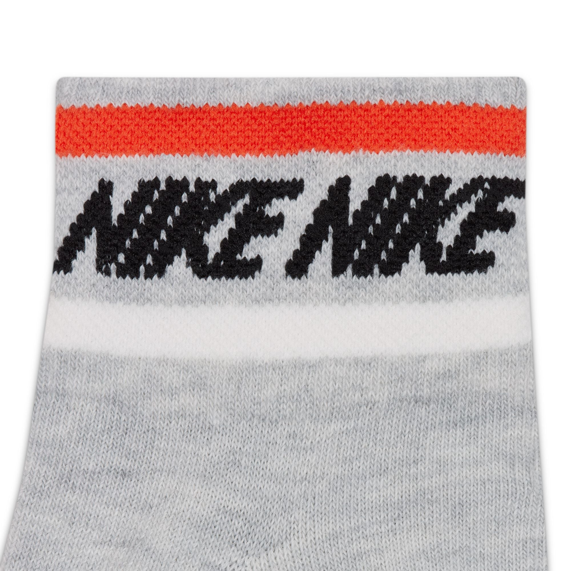 Grey nike ankle socks with red and white stripes and black nike swoosh logo. Free uk shipping over £50
