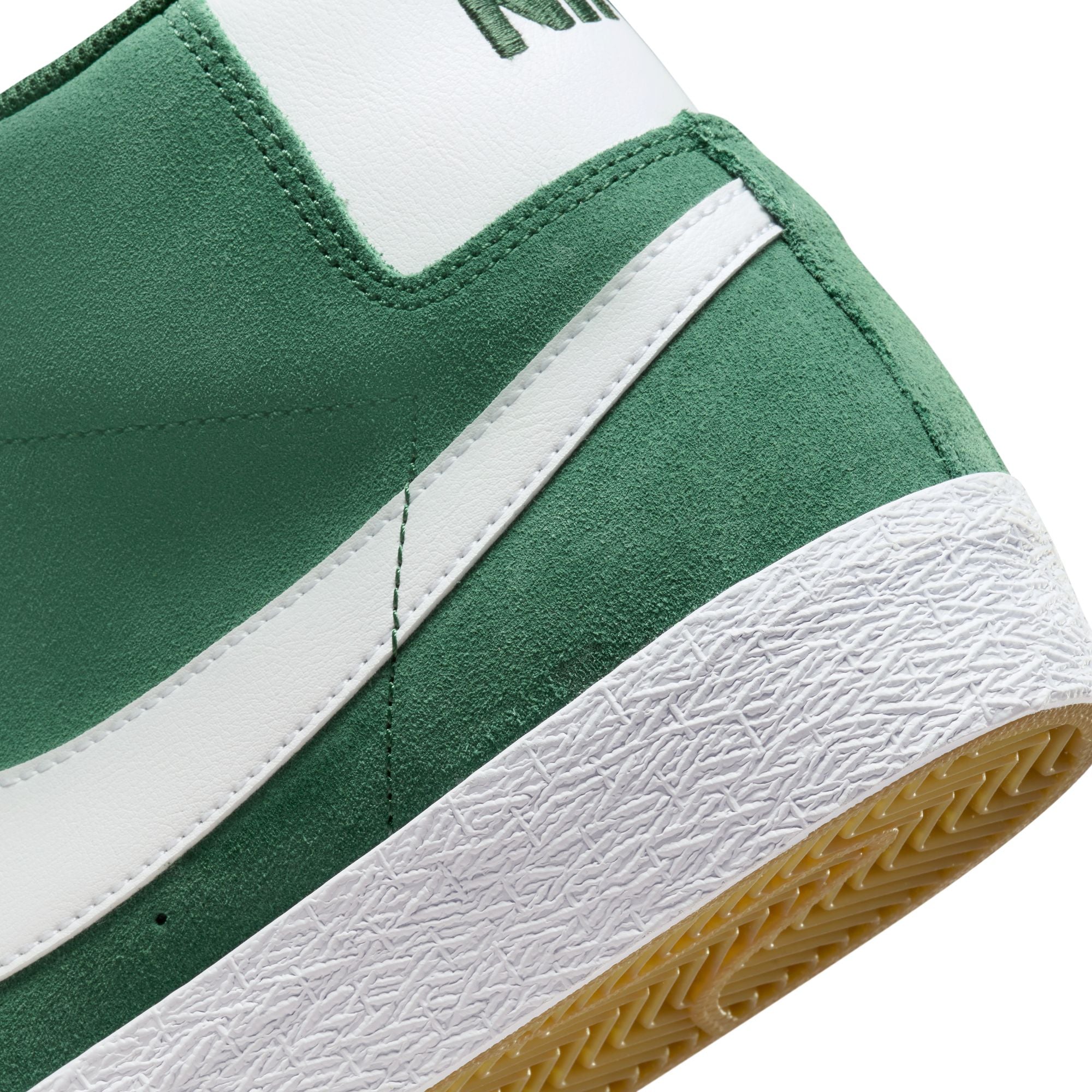 Mid top Nike SB Blazer Mid skate shoes, in Fir Green colourway with white Nike swoosh on sides.