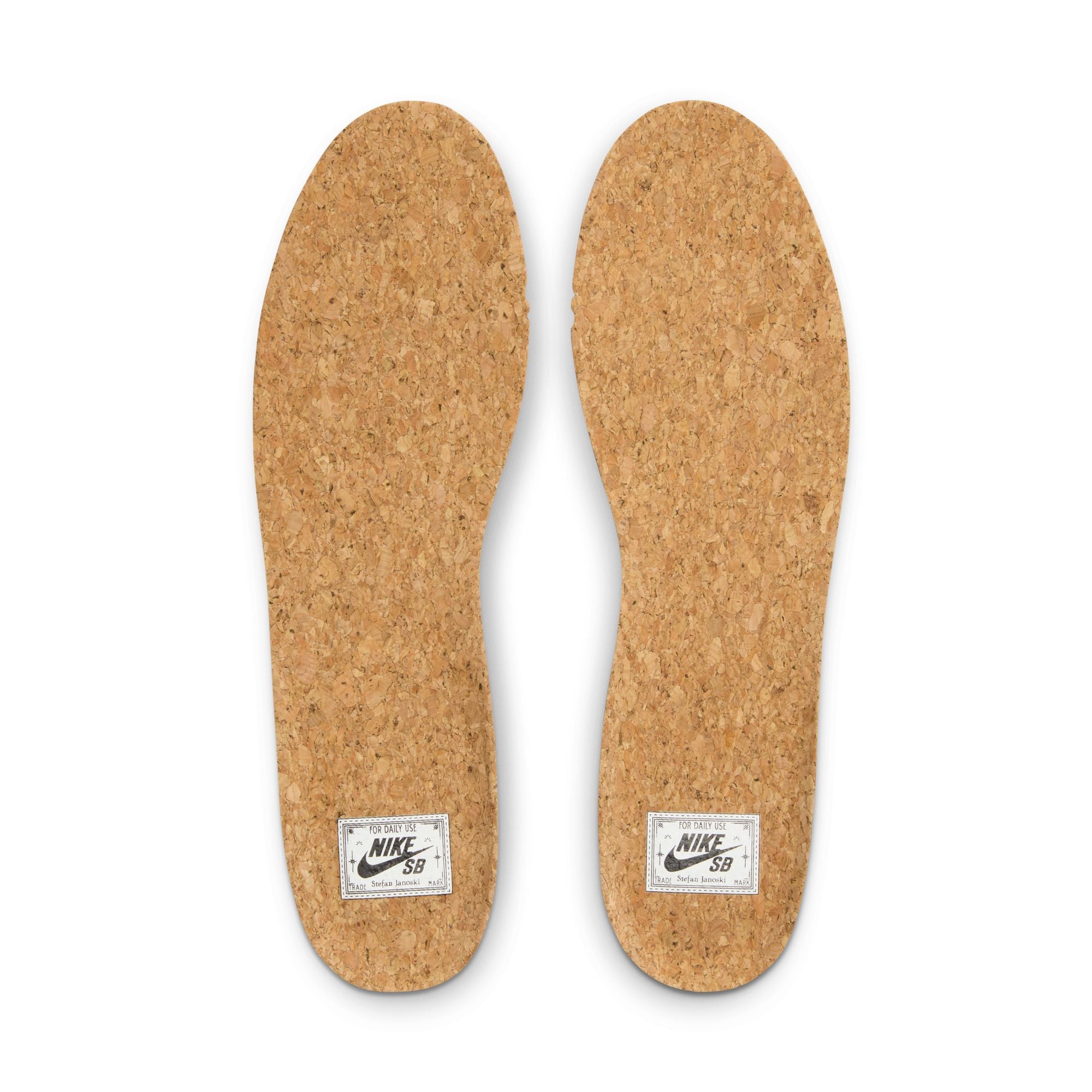 Low top Nike SB janoski skate shoes, in black and white colourway with white nike swoosh on sides.