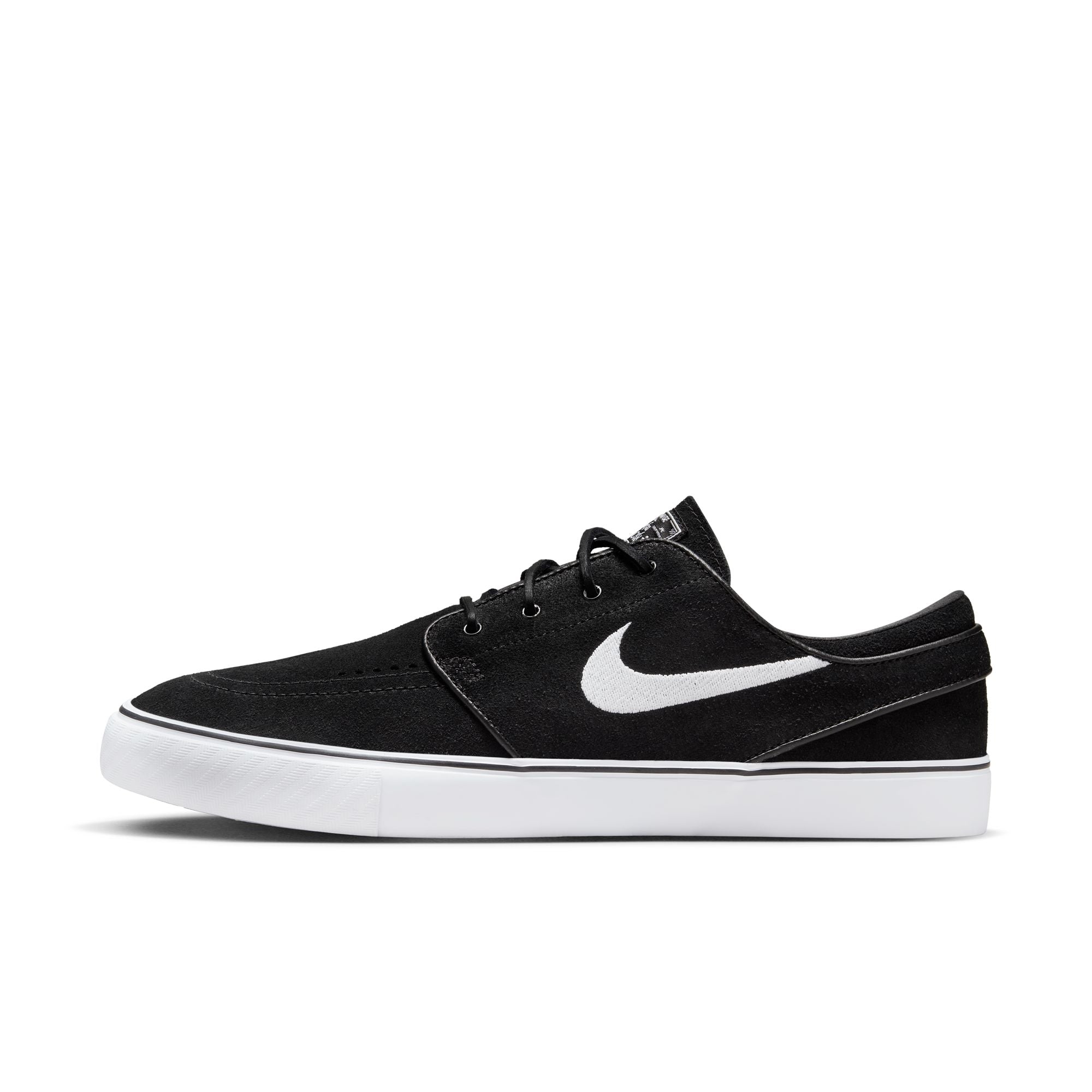 Low top Nike SB janoski skate shoes, in black and white colourway with white nike swoosh on sides. 