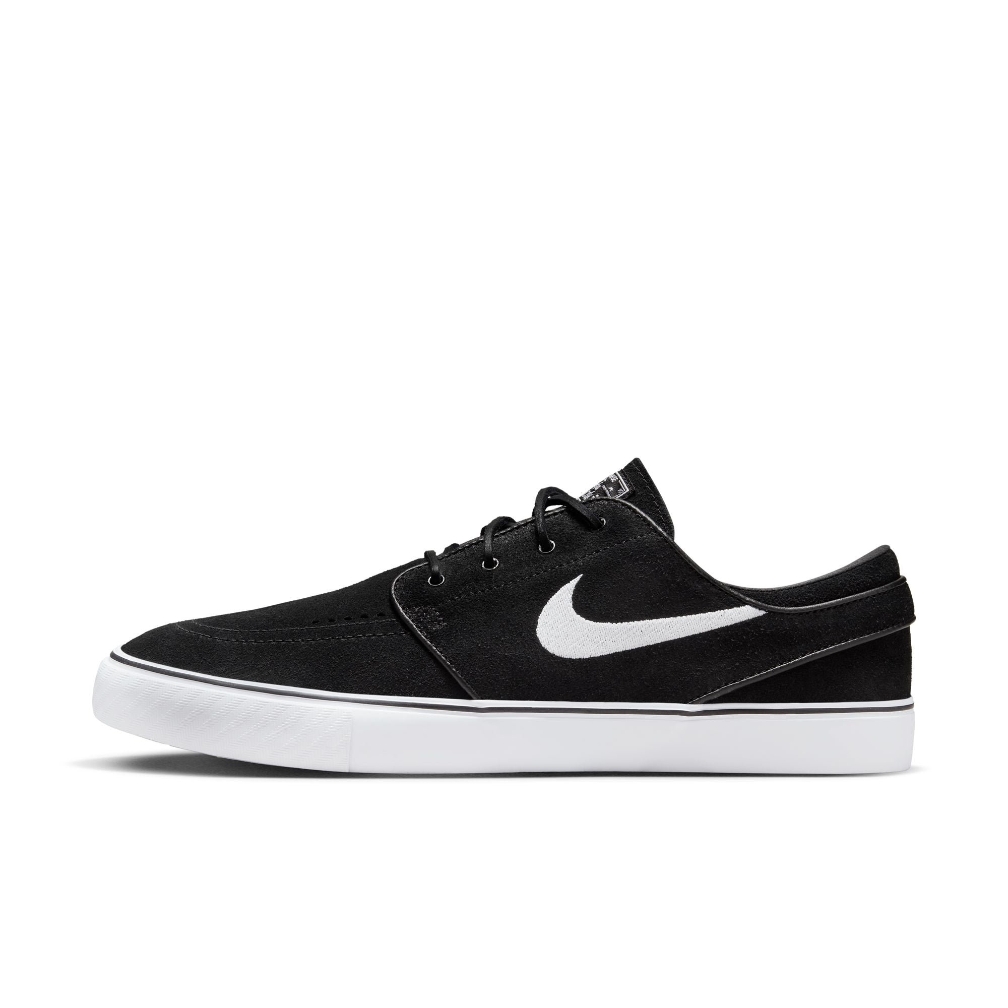 Low top Nike SB janoski skate shoes, in black and white colourway with white nike swoosh on sides.