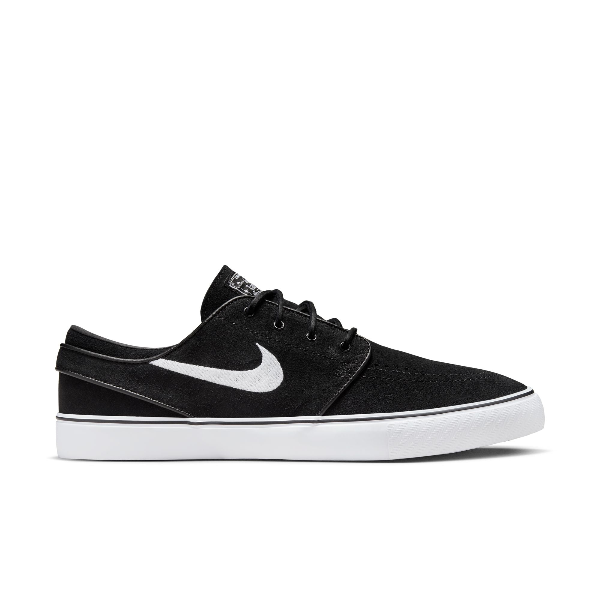 Low top Nike SB janoski skate shoes, in black and white colourway with white nike swoosh on sides.