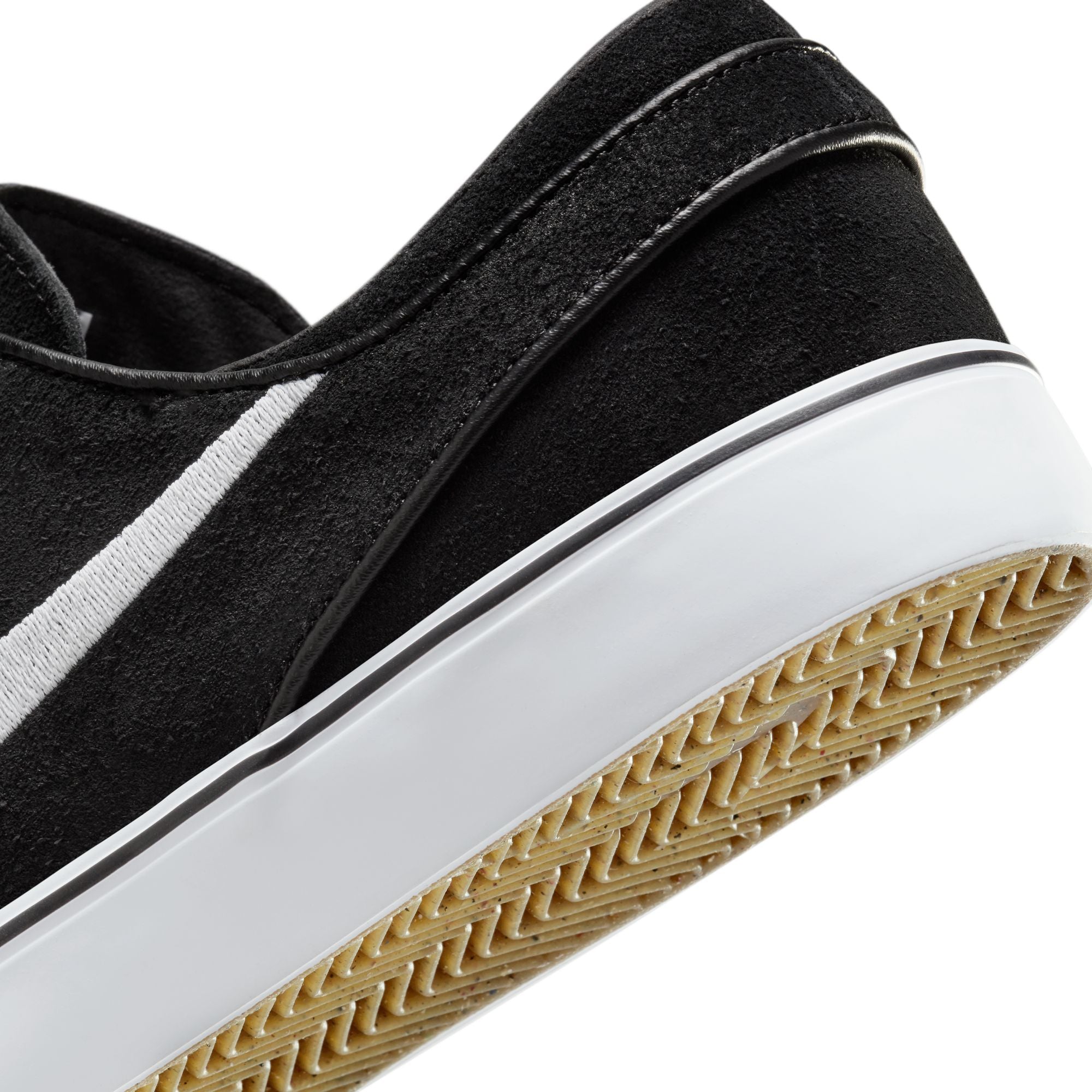 Low top Nike SB janoski skate shoes, in black and white colourway with white nike swoosh on sides. 
