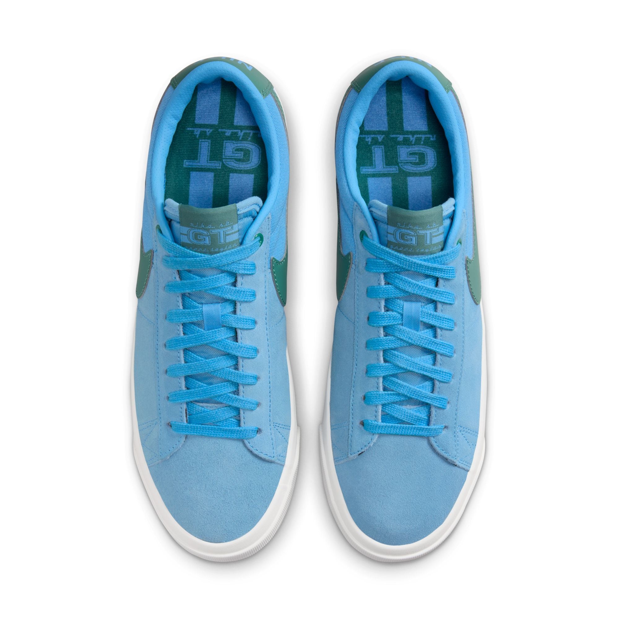 University blue nike sb blazer low top shoes with teal nike tick and white sole. Free uk shipping over £50