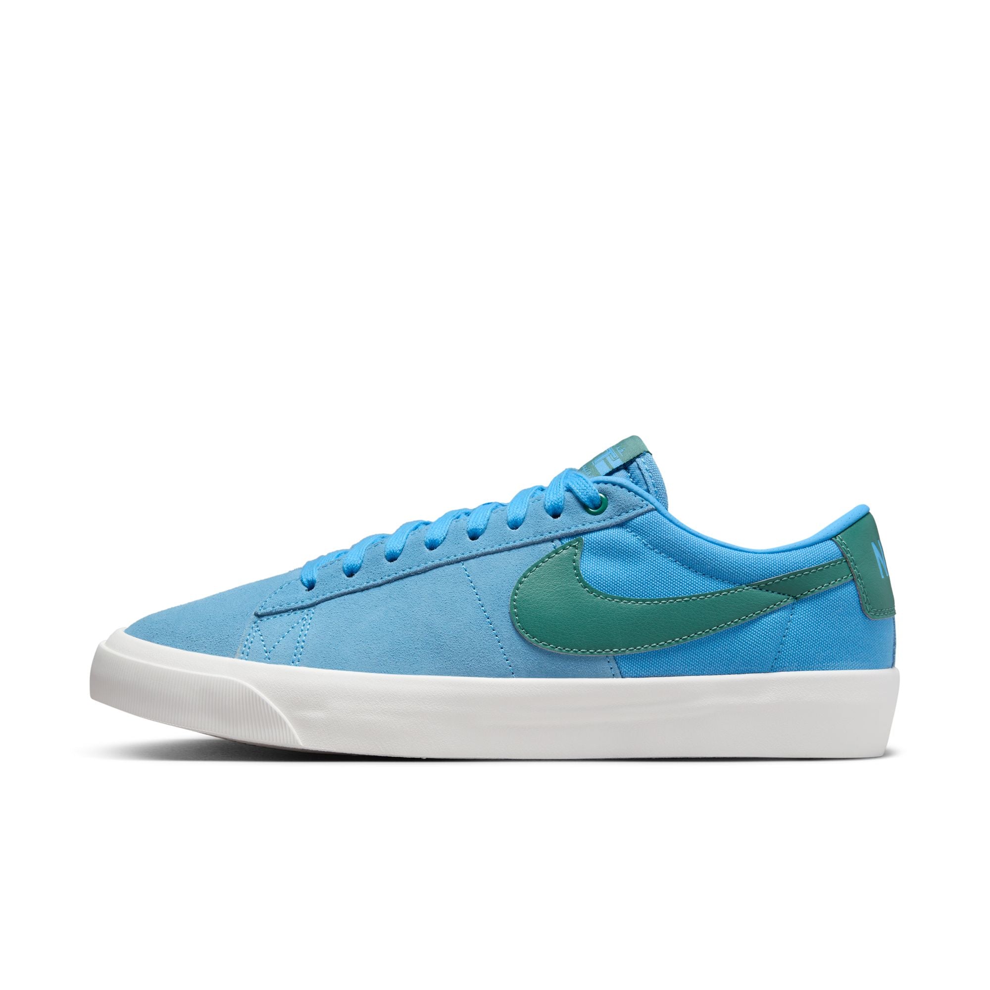 University blue nike sb blazer low top shoes with teal nike tick and white sole. Free uk shipping over £50