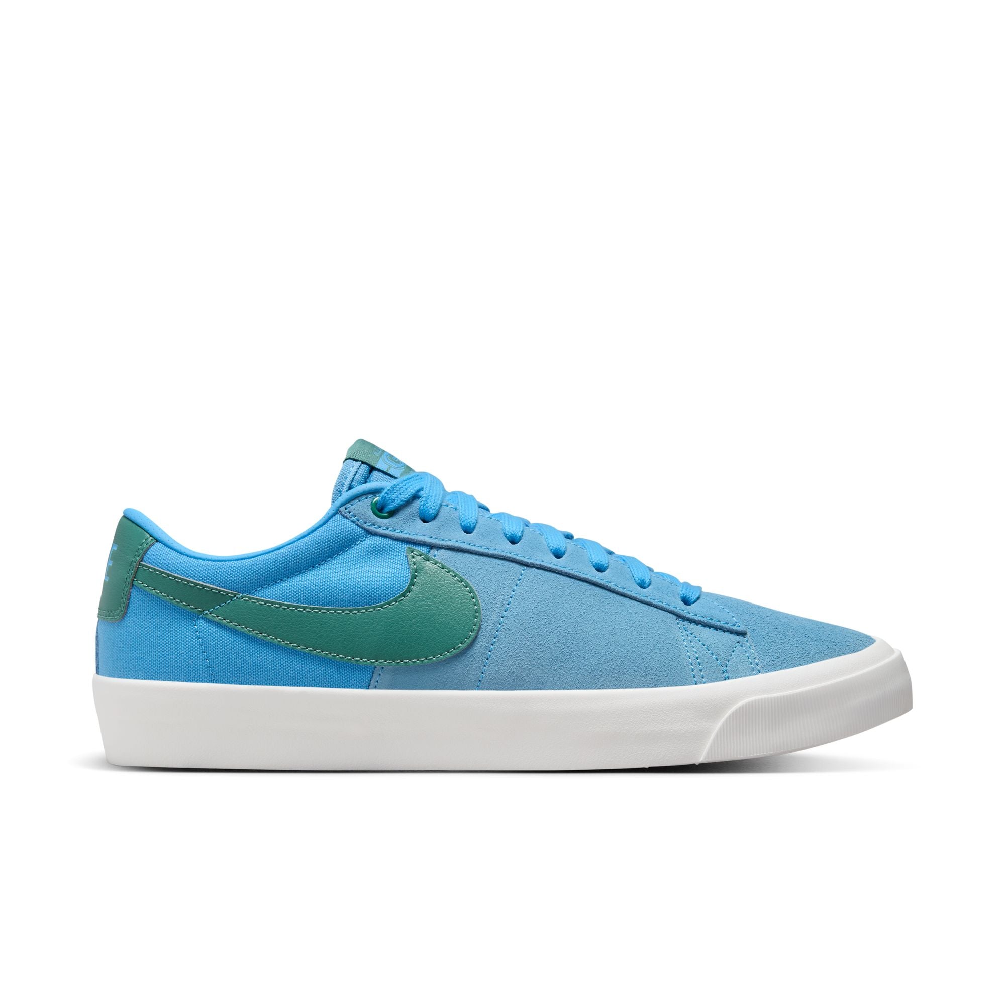 University blue nike sb blazer low top shoes with teal nike tick and white sole. Free uk shipping over £50