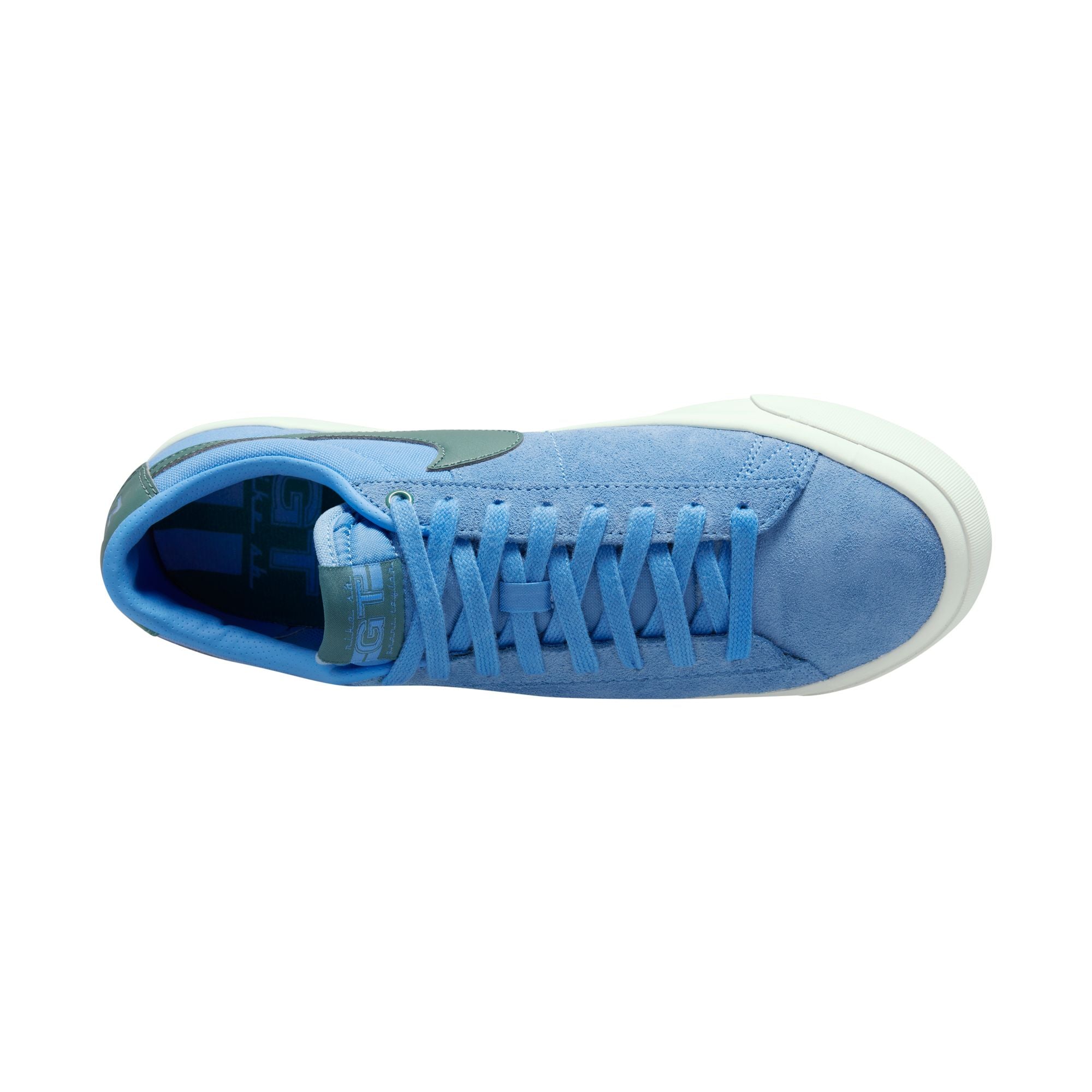 University blue nike sb blazer low top shoes with teal nike tick and white sole. Free uk shipping over £50