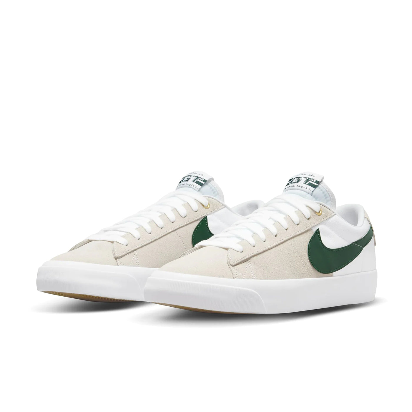 Low top Nike SB Blazer Low GT skate shoes, in white colourway, with green Nike swoosh on sides.