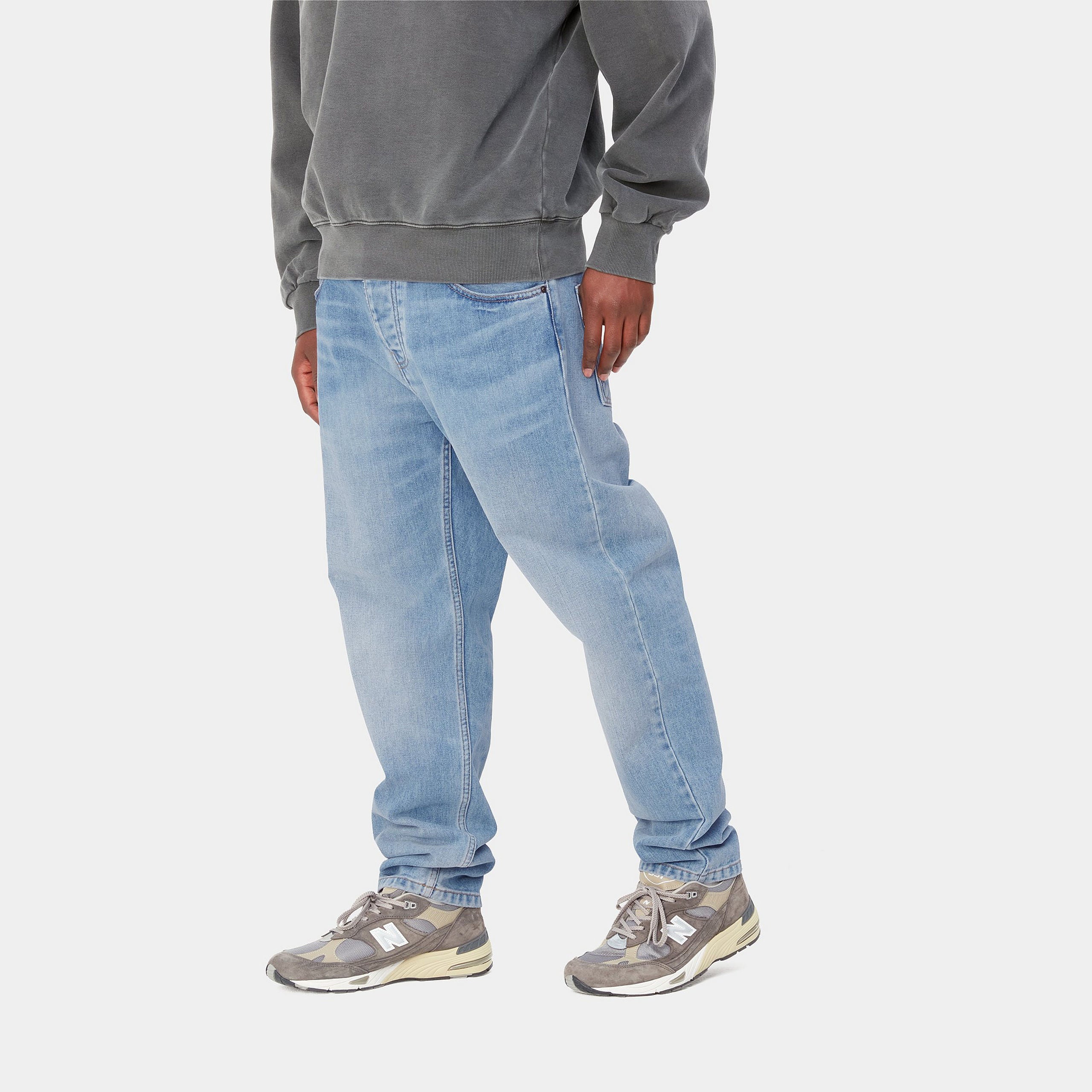 Light blue denim Carhartt trousers with woven logo on back pocket. Free UK shipping on orders over £50.