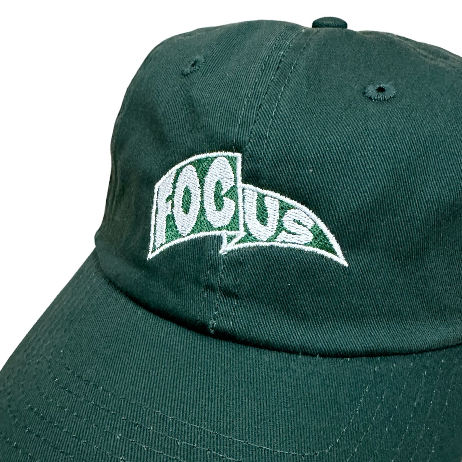 Fir green focus 6 panel cap with white and green focus pendant logo on front. Free uk shipping over £50