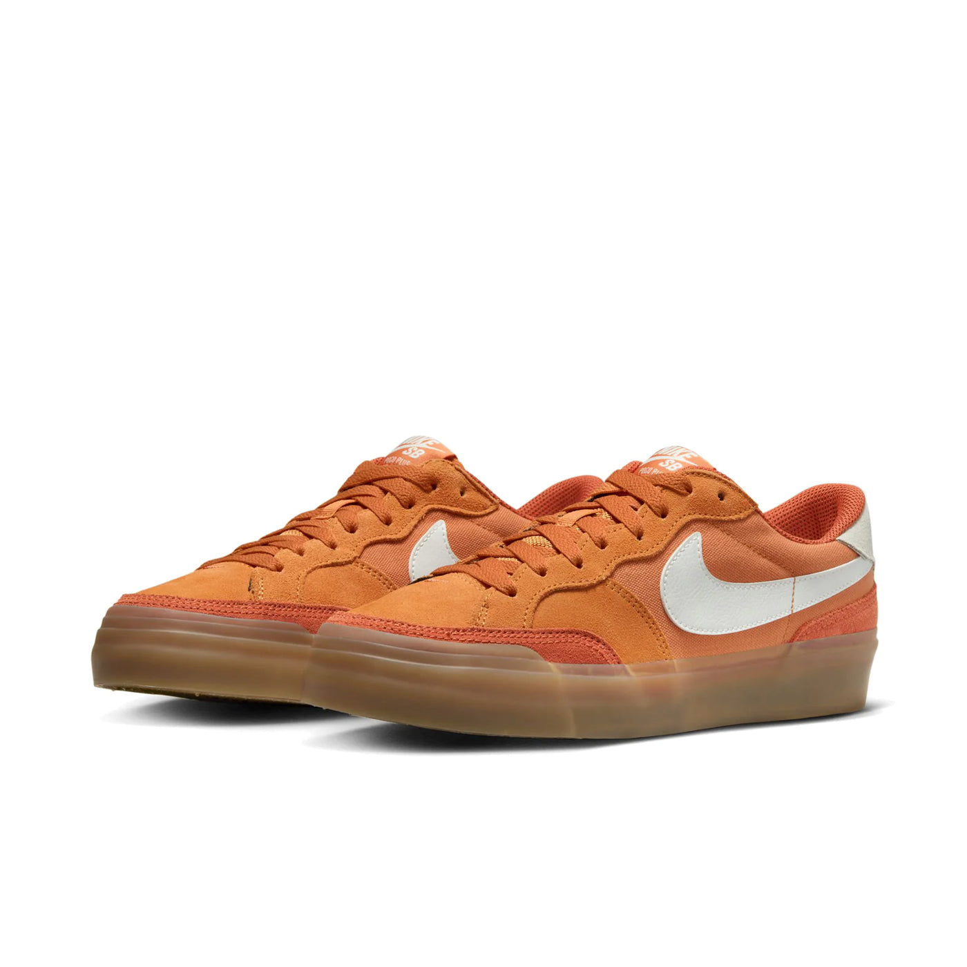 Low top Nike SB Pogo Plus skate shoe in monarch orange colour, with a gum sole and white nike swoosh on sides.
