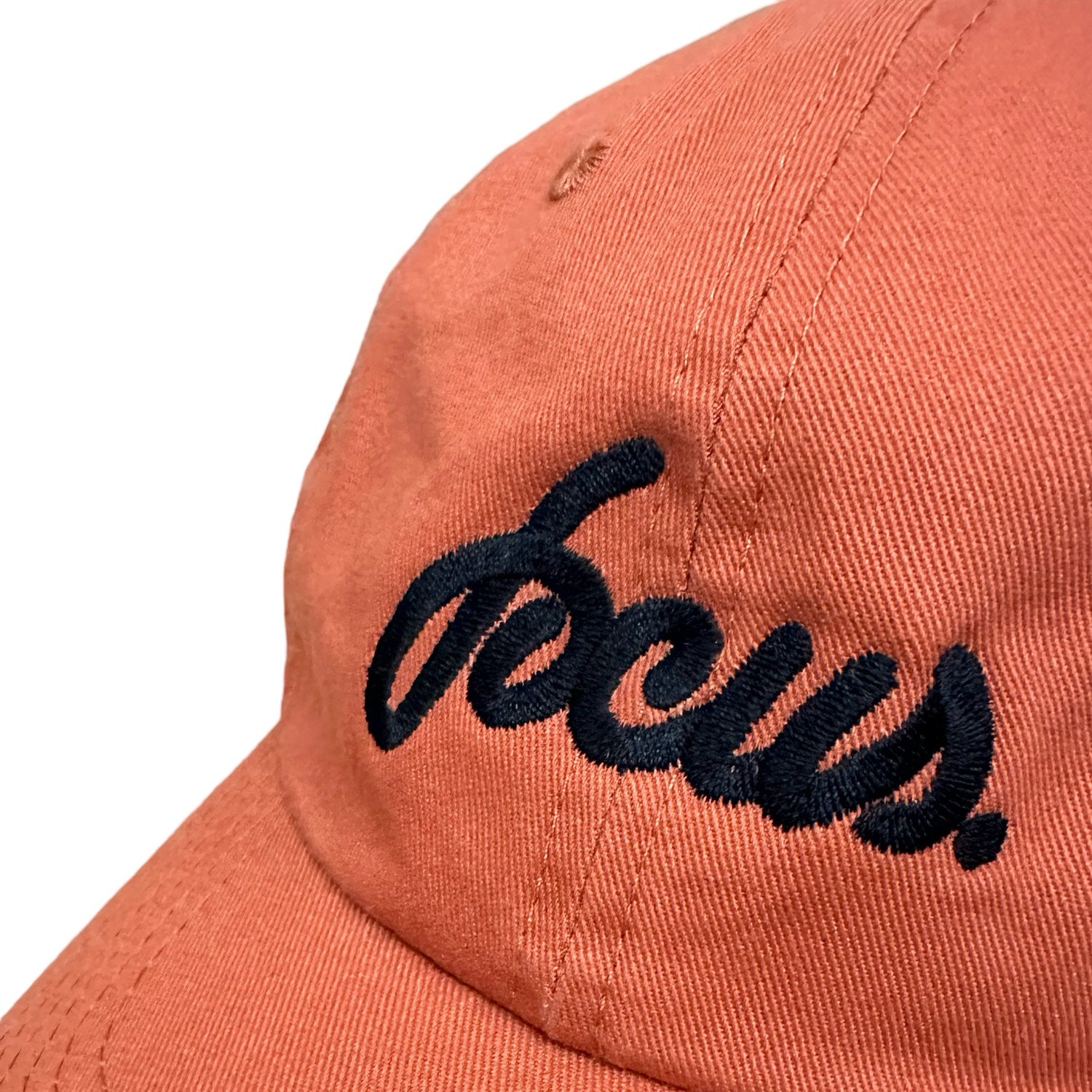 Pumpkin orange focus script logo 6 panel cap with black script logo on front. Free uk shipping over £50