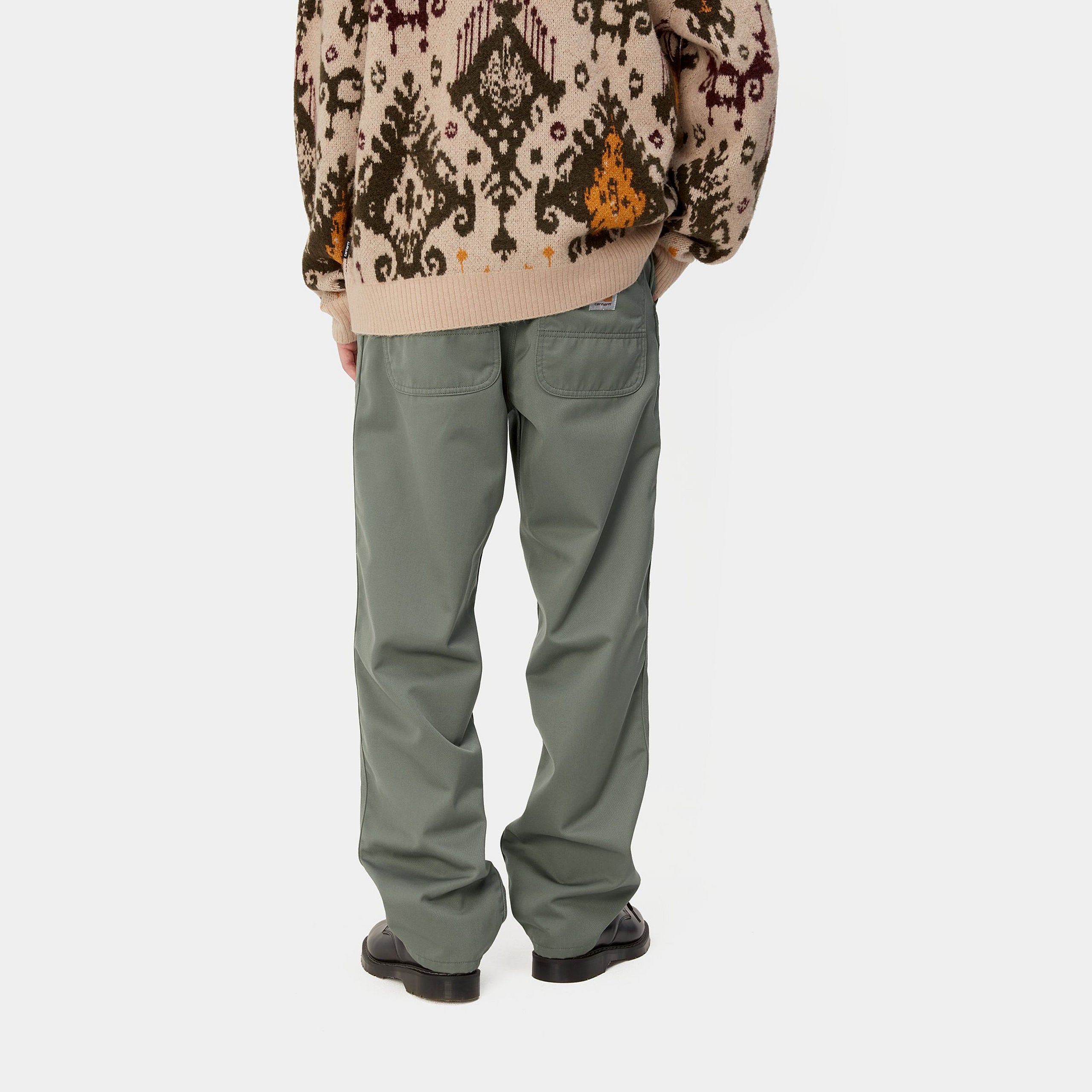 Light green Carhartt Simple pants with woven logo on the back pocket. Free UK shipping on orders over £50.
