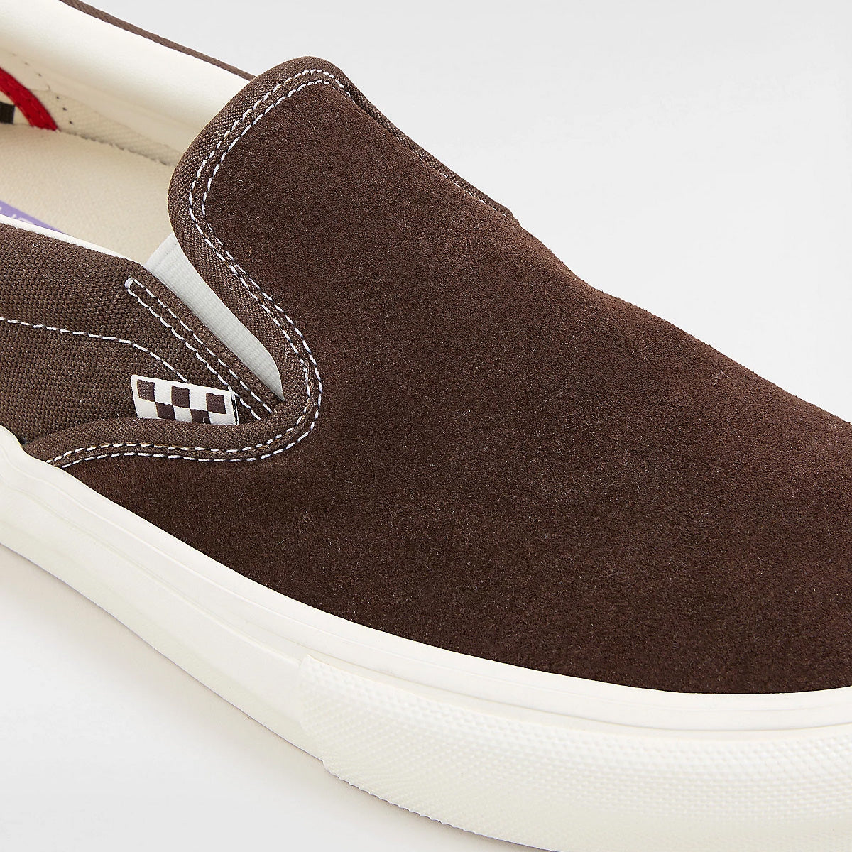Brown vans slip on skate shoes with white soles and checkered tab. Free uk  shipping over £50