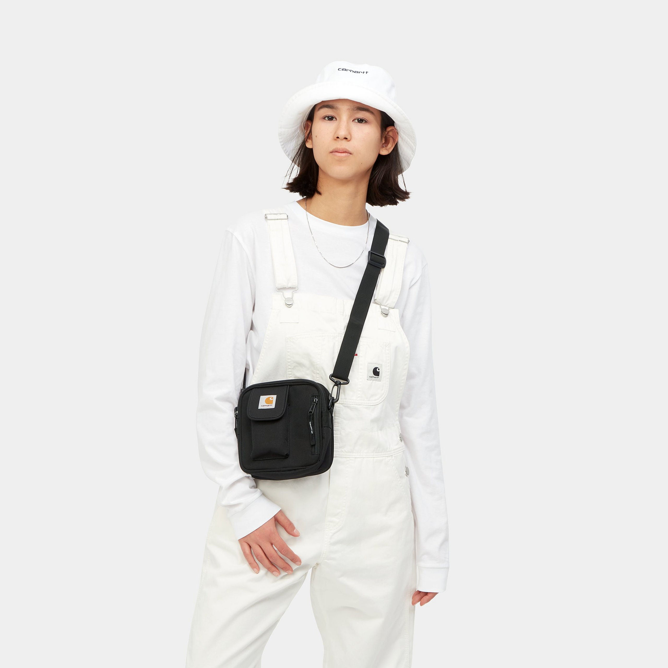 Small black Carhartt shoulder bag with woven logo. Free UK shipping on orders over £50.