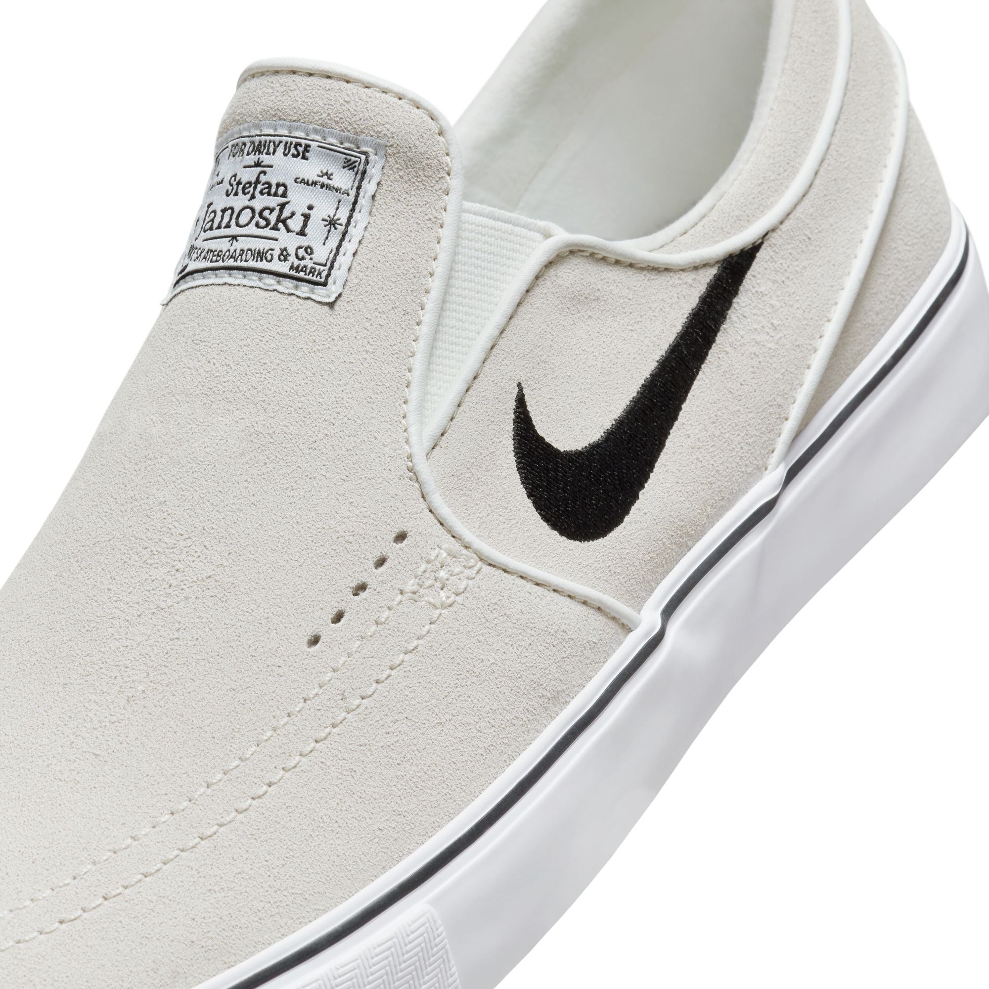 Black and white nike slip ons best sale