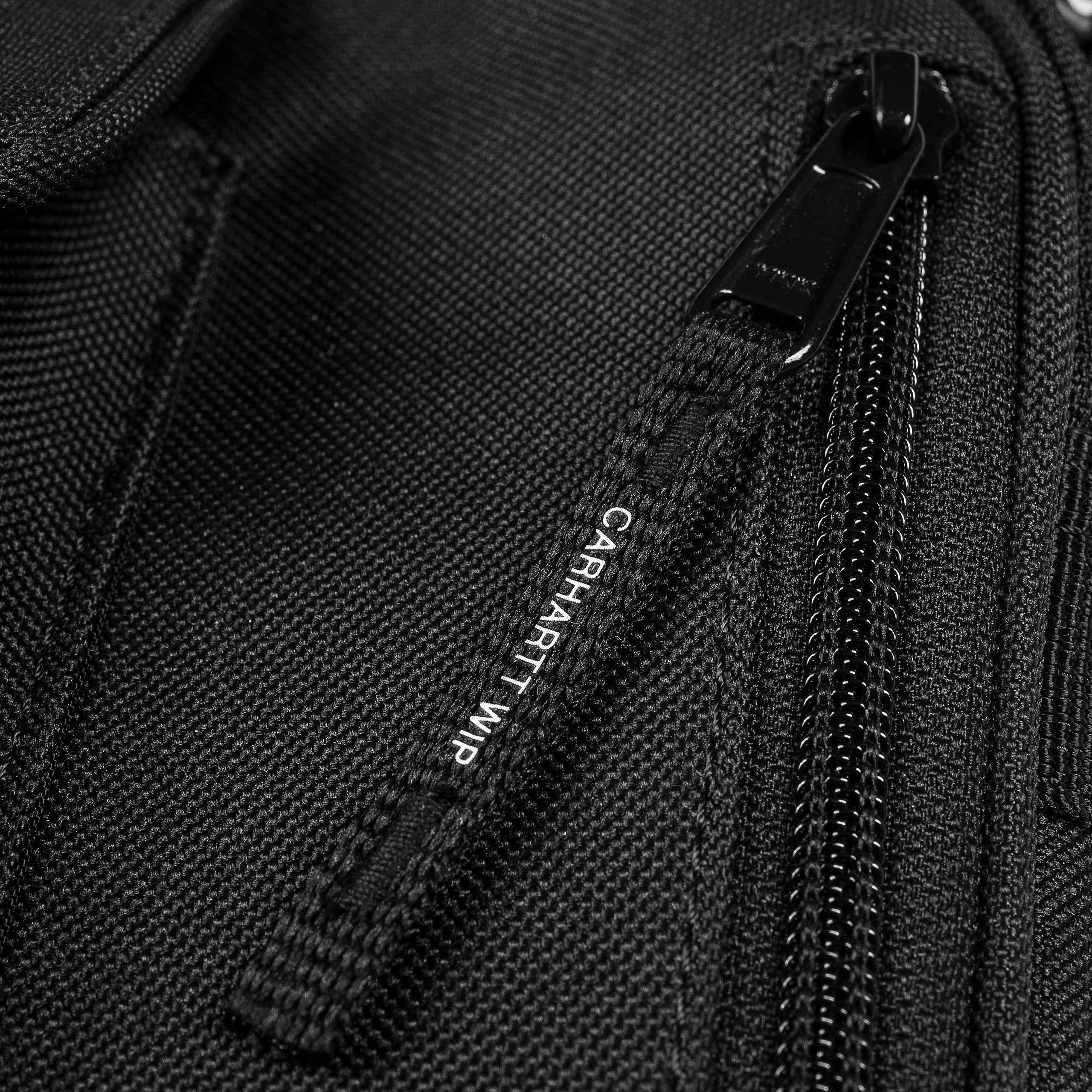 Small black Carhartt shoulder bag with woven logo. Free UK shipping on orders over £50.